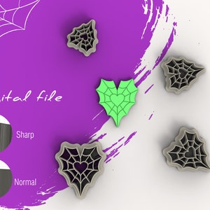 Puede incluir: Cuatro cortadores de galletas en forma de corazón con un diseño de telaraña. Los cortadores son en tonos de gris y verde. El texto "Archivo digital" es visible en la imagen.