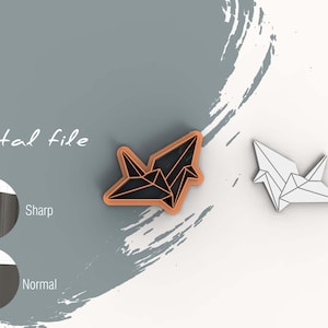 May include: Digital file for a 3D printed origami crane cookie cutter. The cutter is shown in two views: one with a black outline and one with a white outline.