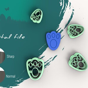 May include: Five paw print cookie cutters, four are green and one is blue. The cookie cutters are on a white surface. The text "Digital file" is in the background.