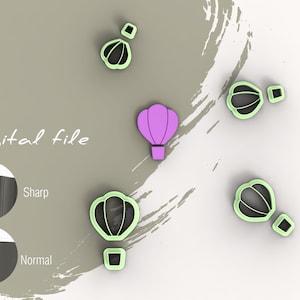 May include: Digital file for a hot air balloon cookie cutter. The image shows five hot air balloon cookie cutters, one is purple, the others are green. The image also shows a close-up of the cookie cutter's edge, showing a sharp and normal cut.