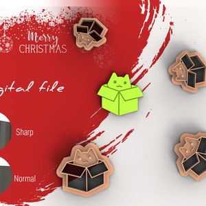 May include: Digital file for a cookie cutter in the shape of a cat in a box. The cutter is shown in three different colours: green, brown, and black. The image also shows a close-up of the cutter's edge, highlighting the sharpness of the cut.