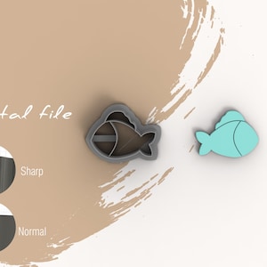 Puede incluir: Dos cortadores de galletas con forma de pez. El cortador de la izquierda es gris y tiene un diseño detallado. El cortador de la derecha es azul claro y tiene un diseño simple. El texto "Archivo digital" es visible en la imagen.