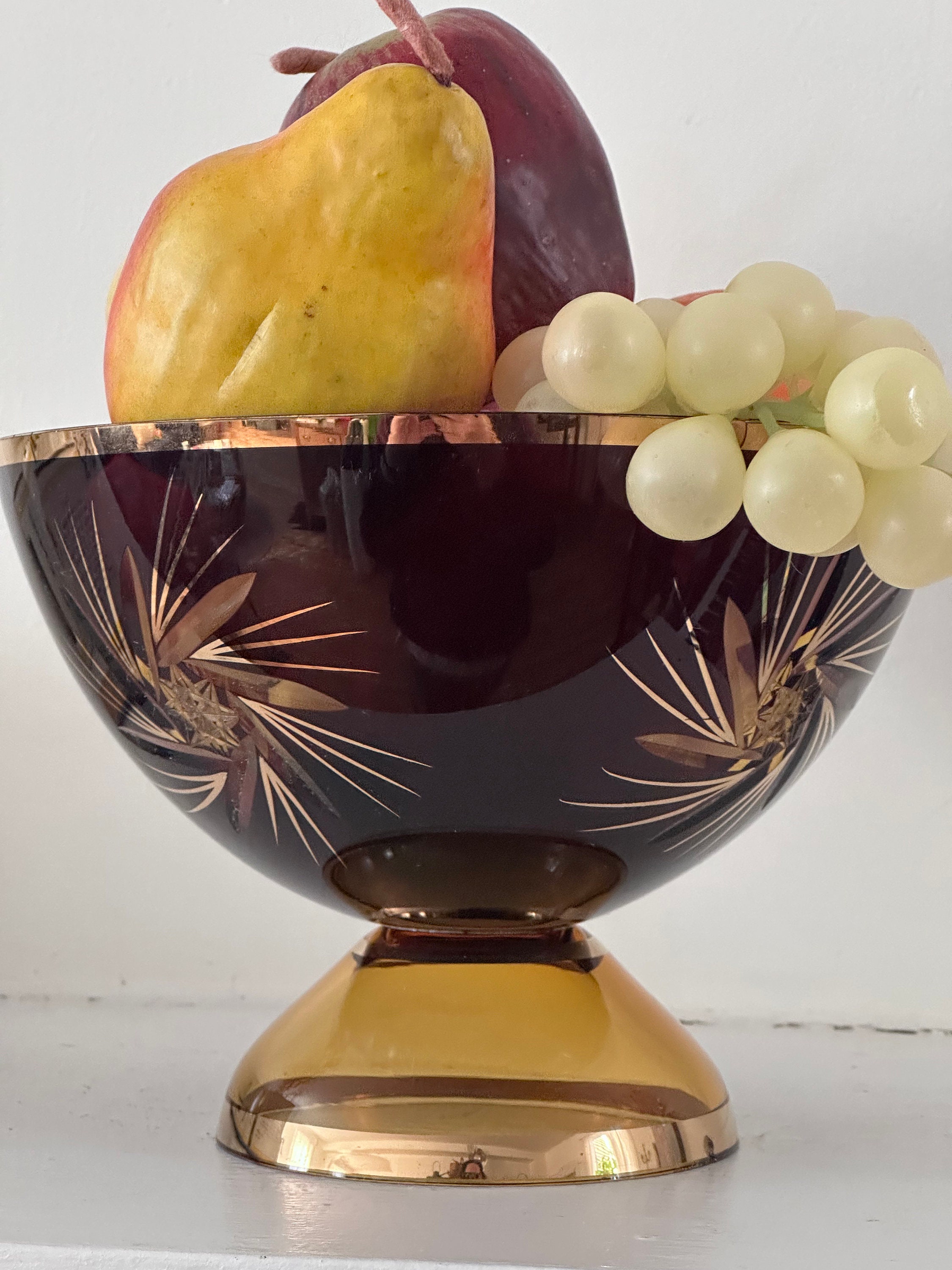 Lot - Two fruitwood bowls with decorative spheres and faux fruit