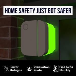 May include: A gray home safety device with a glowing green light, mounted on a wall. The text "HOME SAFETY JUST GOT SAFER" is at the top. Icons below indicate features for power outages, evacuation routes, and finding exits.