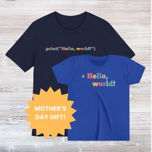 May include: A set of two t-shirts, one navy blue and one royal blue, with a coding theme. The navy blue shirt has the text "print("Hello, world!")" printed on it. The royal blue shirt has the text "> Hello, world!" printed on it in rainbow colors. The shirts are a Mother's Day gift.