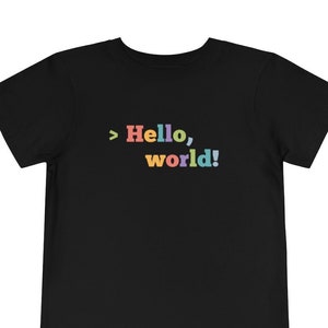 May include: Black t-shirt with a rainbow colored graphic that says "> Hello, world!"