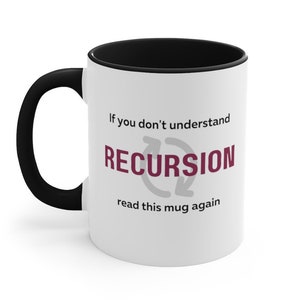 May include: White ceramic mug with a black rim and handle. The mug has a graphic of a circular arrow with the word "RECURSION" in burgundy text. The text "If you don't understand read this mug again" is printed below the graphic.