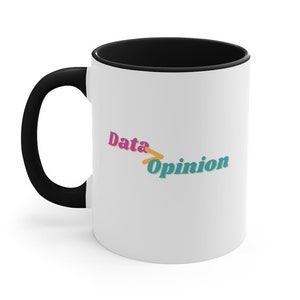 May include: White ceramic coffee mug with a black rim and handle. The mug has the text "Data > Opinion" printed on it in pink, teal, and yellow.