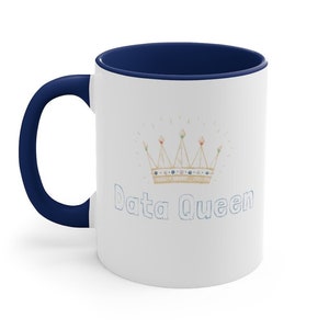 May include: White ceramic mug with a blue rim and handle. The mug features a gold crown with colorful jewels and the text "Data Queen" in blue.