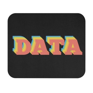 May include: A black mouse pad with the word "DATA" in rainbow colors. The letters are stacked on top of each other, creating a 3D effect.