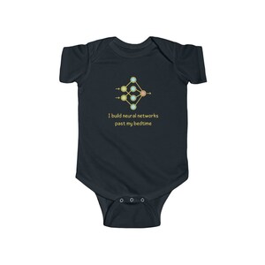 May include: A dark blue baby grow with a gold neural network diagram and the text "I build neural networks past my bedtime".