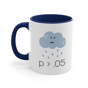 May include: White ceramic coffee mug with a blue rim and handle. The mug features a cartoon illustration of a blue cloud with a sad face and raindrops falling from it. The text "p > .05" is printed below the cloud.