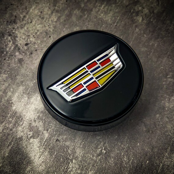 Cadillac floating 2024 center caps