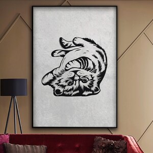 May include: Black and white illustration of a cat upside down with its paws in the air and a playful expression on its face.