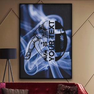 May include: A blue and black digital art print featuring a football player in a dynamic pose with a football. The text "YOUR TEXT" is written vertically on the football. The number "#10" is visible on the player's uniform.