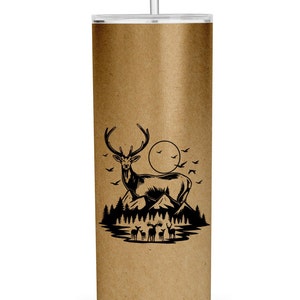 May include: A brown stainless steel tumbler with a black silhouette of a deer standing on a mountain with a full moon in the background. There are smaller deer in the foreground.