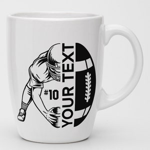 May include: White ceramic mug with a black and white illustration of a football player catching a football. The text "YOUR TEXT" and "#10" are printed on the mug.