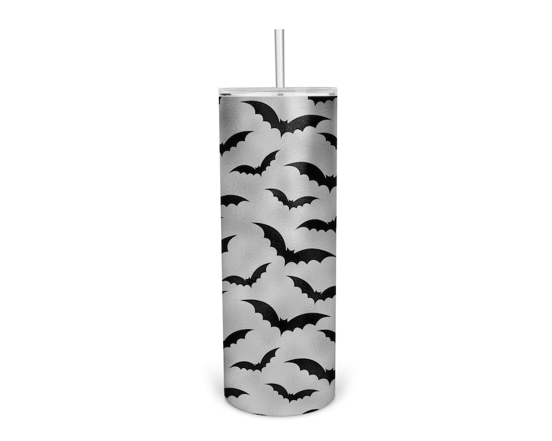 May include: A silver tumbler with a black bat pattern. The tumbler has a clear lid and a clear straw.