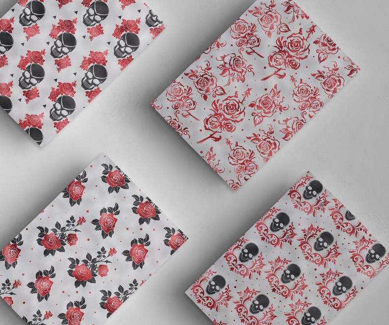 May include: Four different patterned wrapping paper designs. Each design features a white background with a repeating pattern of either red roses or black skulls.