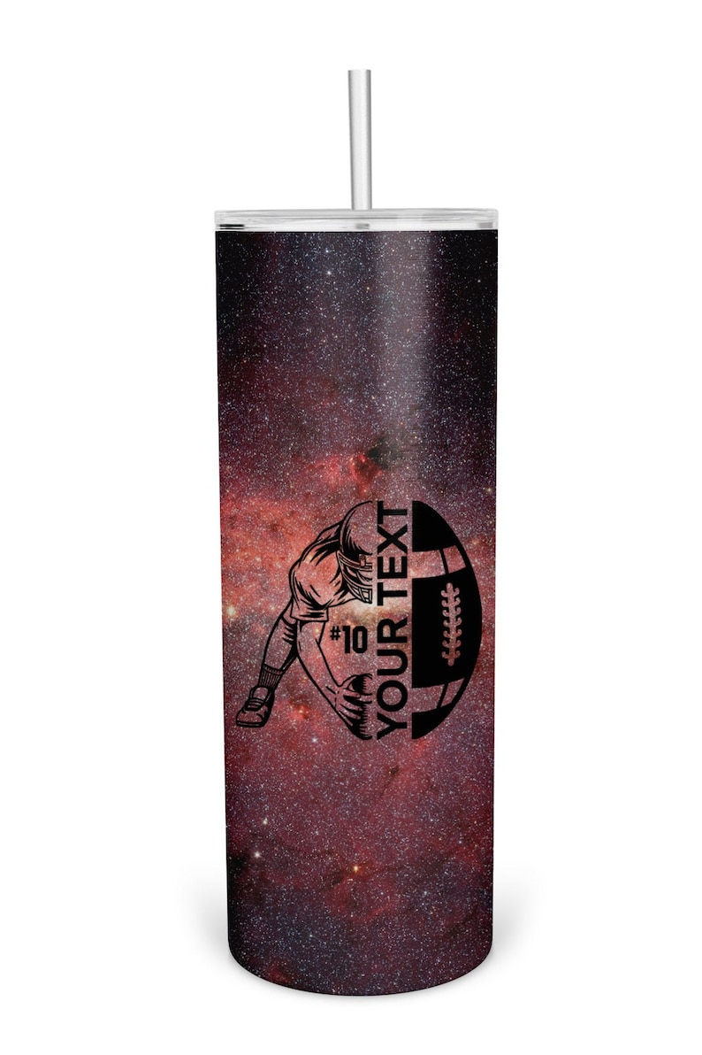 May include: A black and white illustration of a football player holding a football with the text "YOUR TEXT" on a red and black galaxy print tumbler.