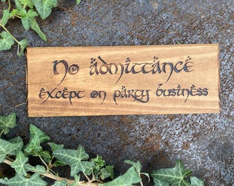 Wooden signs reading "No Admittance Except on Party Business"