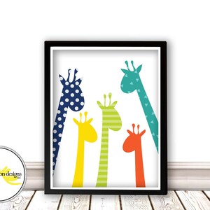 May include: A framed print featuring five colorful giraffe silhouettes with different patterns, including polka dots, stripes, and triangles. The giraffes are arranged in a cluster, with their necks extending upwards.