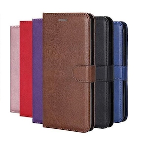 May include: A selection of colourful phone cases in shades of pink, red, purple, brown, black, and blue. The cases are textured and have a wallet design with a magnetic clasp.