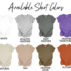 May include: Image showcasing a variety of t-shirt colors. The available colors are white, athletic heather, deep heather, heather team purple, natural, tan, heather olive, and autumn. The text "Available Shirt Colors" is at the top.