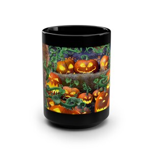 May include: Black coffee mug with a Halloween-themed design featuring a group of glowing jack-o'-lanterns with carved faces, surrounded by green vines and leaves.