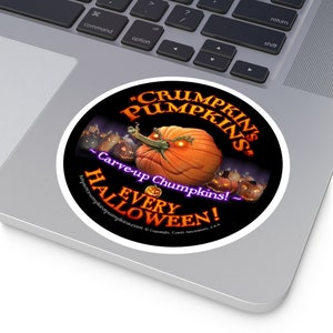 May include: A round sticker with a black background and a cartoon pumpkin with a toothy grin. The text reads "CRUMPKIN'S PUMPKINS" in a purple font with a white outline. Below the pumpkin, the text reads "Carve-up Chumpkins! EVERY HALLOWEEN!" in a purple font with a white outline. The sticker has a white border.