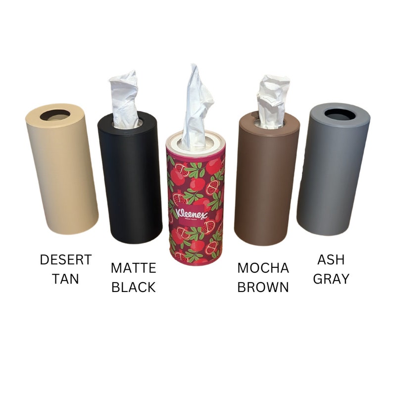 May include: Five tissue box holders in different colours: desert tan, matte black, red with a pomegranate pattern and the word "Kleenex", mocha brown, and ash grey.