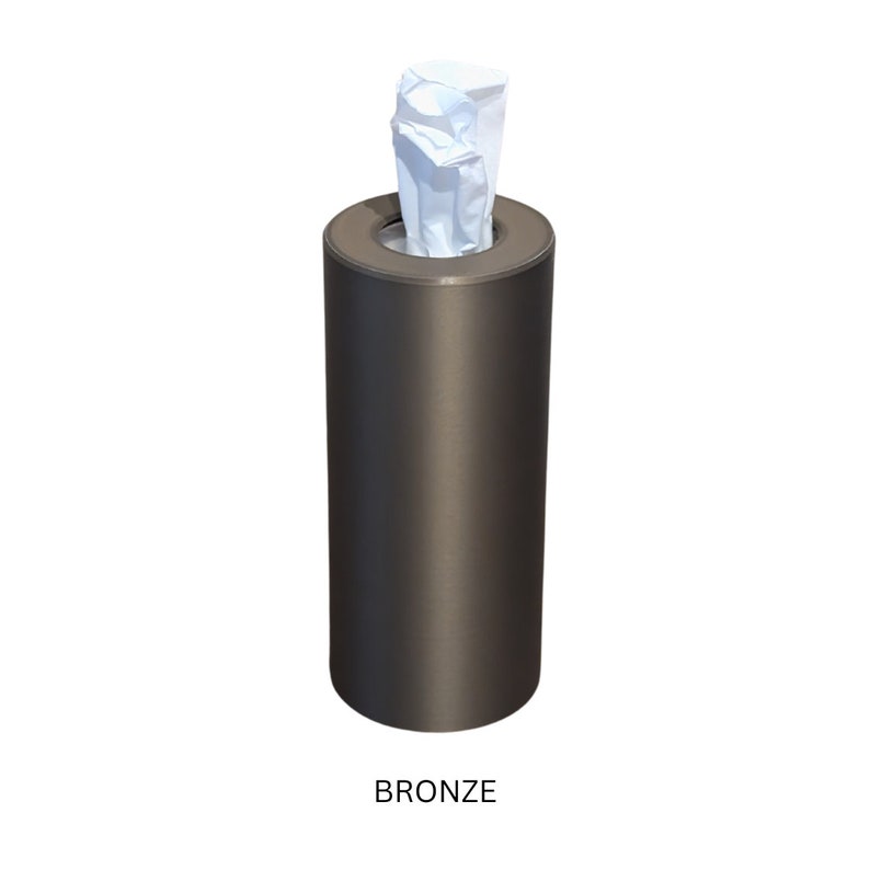 May include: A bronze tissue dispenser with a white tissue inside.