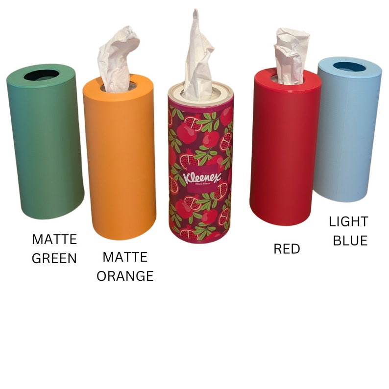May include: Five tissue box holders in different colours: matte green, matte orange, red, light blue, and a patterned holder with a red background and a white "Kleenex" logo.