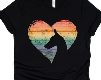 May include: Black t-shirt with a rainbow heart design featuring a silhouette of a dog's head.