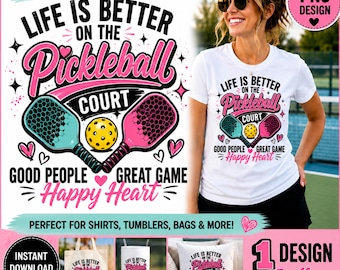 May include: A white t-shirt featuring a graphic design with the text 'LIFE IS BETTER ON THE PICKLEBALL COURT', 'GOOD PEOPLE', 'GREAT GAME', and 'HAPPY HEART'. The design includes a blue and a pink pickleball paddle and a yellow ball.