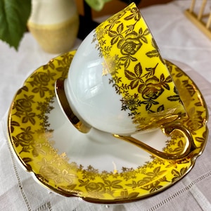Vintage Stanley fine bone china teacup and saucer, yellow and gold, mid-century modern