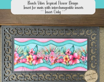 May include: A black doormat with a decorative border and a pink and turquoise insert featuring tropical flowers and the text "Beach Vibes".