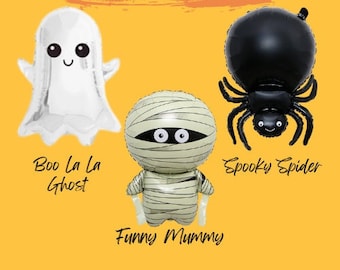 May include: A set of four Halloween-themed Mylar balloons. The balloons are shaped like a ghost, a mummy, a spider, and a ghost. The balloons are all white, black, and green. The text "Halloween Mylar Balloons" is written in black on a red background. The text "Boo La La Ghost", "Funny Mummy", "Spooky Spider", and "Boo La La Ghost" are written below each balloon.