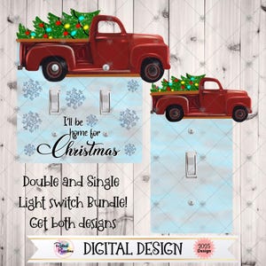 Op de afbeelding: Kerstthema lichtschakelaars met een rode vrachtwagen met een kerstboom. De lichtschakelaars zijn lichtblauw met sneeuwvlokontwerpen en de tekst "I'll be home for Christmas".