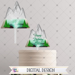 May include: Two printable cake toppers featuring a mountain range with a lake and trees. The first topper has a blue and green lake and the second topper says "Happy Birthday Mike".