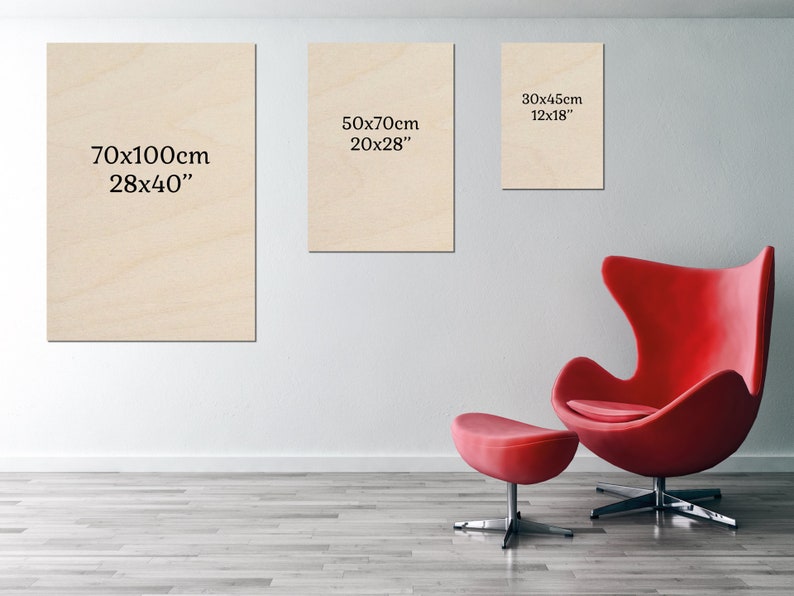 a red chair sitting in front of a white wall