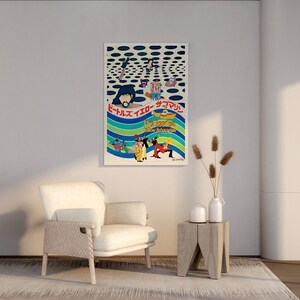 a room with a white chair and a poster on the wall