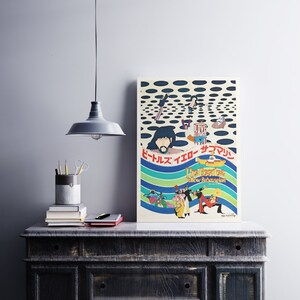 a poster on a table next to a lamp