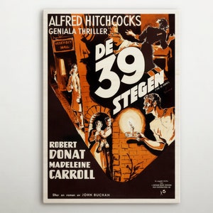 May include: A vintage film poster for the movie "The 39 Steps" directed by Alfred Hitchcock. The poster features a black and white image of a man and woman in a dramatic pose, with the title of the film in large, bold letters. The poster also includes the names of the actors, Robert Donat and Madeleine Carroll, and the tagline "Genial Thriller".