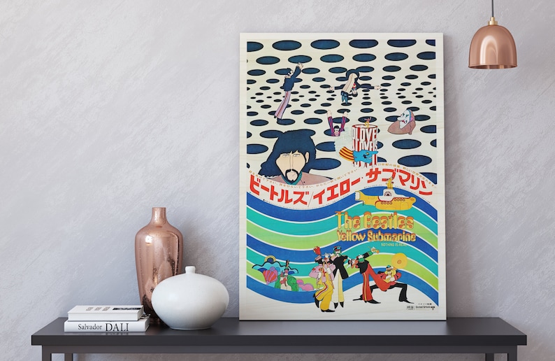 a poster on a shelf next to a vase