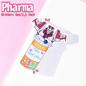 May include: A sticker featuring a red and white robot character in a pill bottle with the text "Take your pills" and pink hearts. The sticker is 8 cm/3.5 inches.