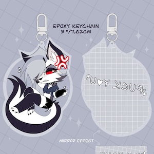 Peut inclure: Un porte-clés en époxy de 7,62 cm représentant un personnage de loup de dessin animé en noir et blanc. Le loup a une expression de colère et le texte "FUCK YOU" est écrit au dos du porte-clés.