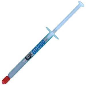 May include: A white and blue syringe with the text "GD900" printed on the side. The syringe has a red cap and is designed for applying thermal paste. The syringe has a plunger and a small nozzle.