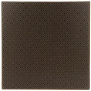 May include: A square, dark brown placemat with a textured, dotted pattern. The placemat has a subtle sheen and a slightly raised texture, creating a visually interesting surface. The edges are clean and well-defined.