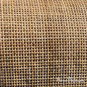 May include: Close-up of a woven cane material with a natural brown color. The material is woven in a tight, even pattern, creating a smooth, textured surface. The text "Haru Vietnam" is visible in the lower right corner of the image.
